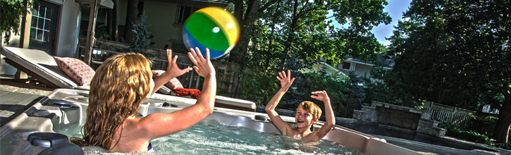 Two children having fun in a Hydropool hot tub