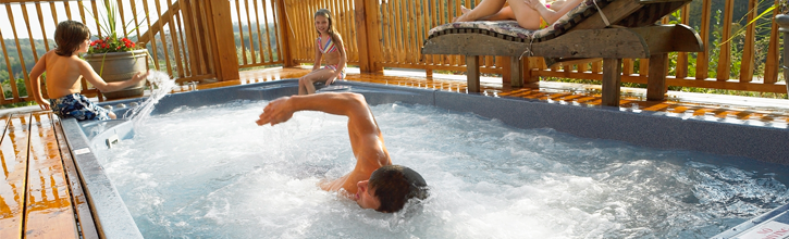 Man taking a swim in a swim spa